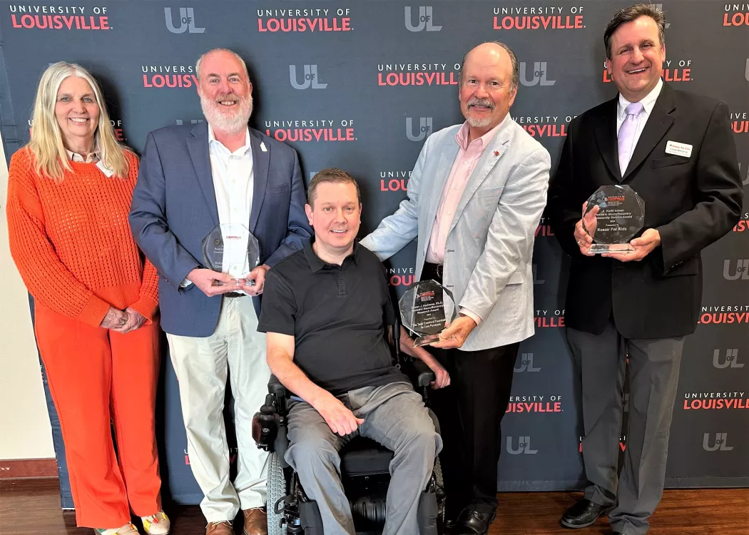 UofL's Kosair for Kids Center for Pediatric NeuroRecovery presented awards to community organizations in May. Left to right: Susan Harkema, Hal Hedley, Todd Crawford, Keith Inman and Chris Williams.