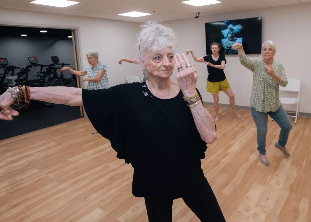 Senior adult woman doing Tai Chi