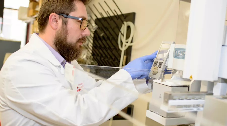 Researcher Pawel Lorkiewicz working a lab. He established methods for detecting and quantifying urinary metabolites of VOCs which are used in the human and wastewater studies for VOC exposure.