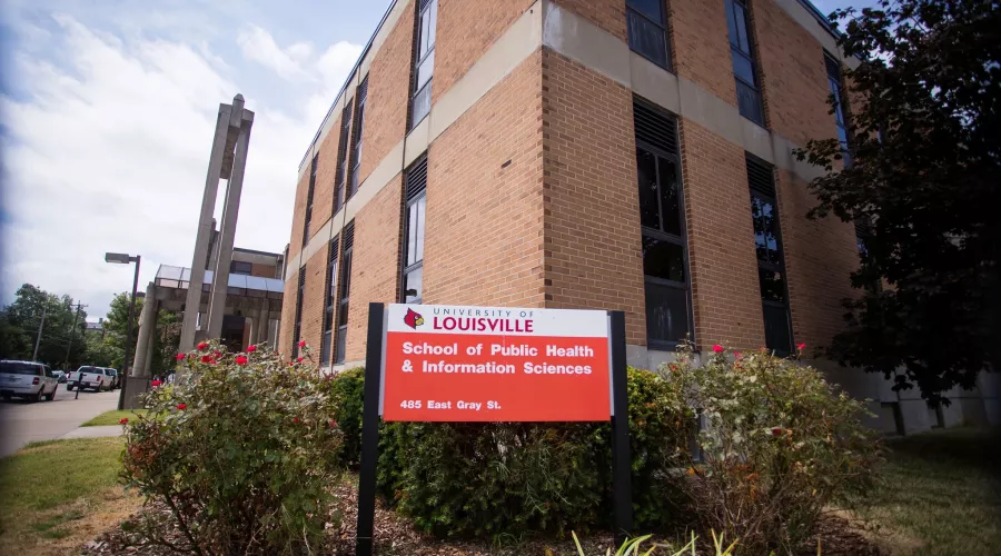 red and white sign in front of building that says University of Louisville School of Public Health and Information Sciences, 485 E. Gray St.